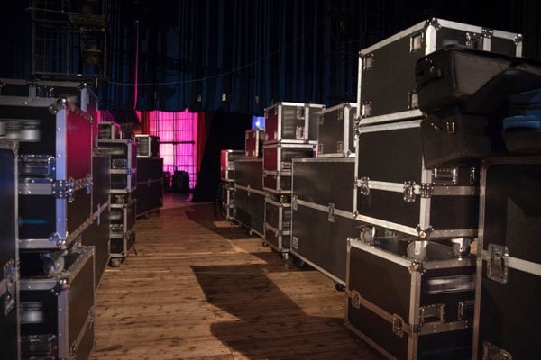 Backstage view of concert equipment boxes
